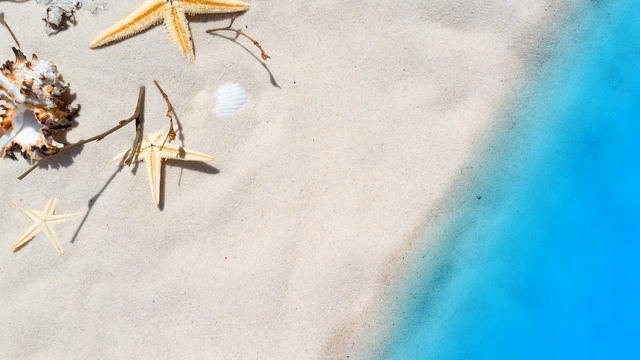 A wide Sicilian bay with pale sand and clear turquoise shallow water, a rocky headland at one end, the kind of beach where a lost ring stays close to where it fell