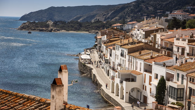 A sandy cove with clear turquoise sea on the Spanish coast, the kind of beach where people look for someone with a metal detector to find a lost ring